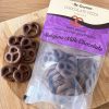 Milk chocolate dipped pretzels in a pouch presentation