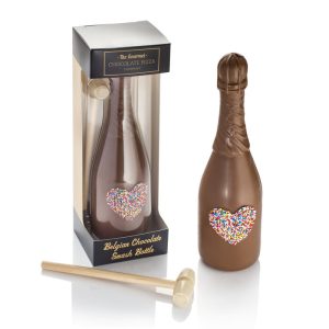 milk chocolate bottle with little wooden hammer