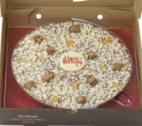 close up Crunchy Munchy chocolate pizza with Happy Birthday plaque