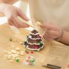 Decorating chocolate Christmas tree