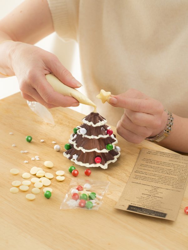 Decorating chocolate Christmas tree