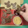 Dipping chocolate reindeer in raspberry sauce